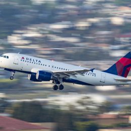 A Delta Air Lines flight taking off from an airport