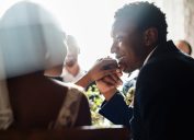 Couple Kissing Hands at wedding