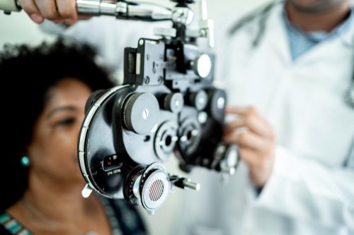 Mature women in medical appointment with ophthalmologist