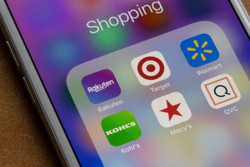 Rakuten mobile app is seen among other shopping apps on an iPhone. Rakuten works on stores such as Target, Walmart, Kohl's, Macy's, OVC, and the like.