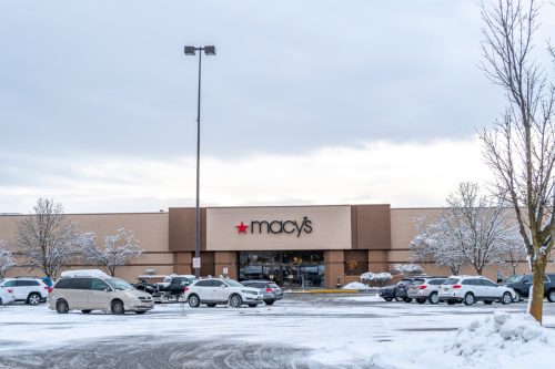 A Macy's store and parking lot in winter in the Pacific Northwest still open after company restructuring.