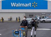 People exit the Walmart store on December 24, 2020 in Valley Stream, NY.