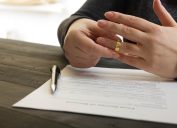 Woman removes wedding ring while filing for divorce