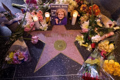 Betty White's Hollywood Walk of Fame star decorated with candles and flowers following her death