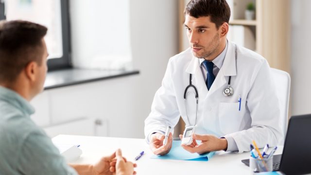Man talking to doctor about being screened for diabetes