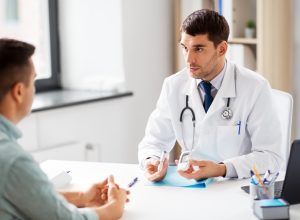 Man talking to doctor about being screened for diabetes