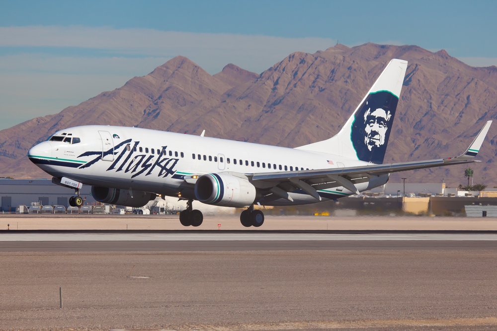 An Alaska Airlines plane landing at an airport