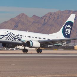 An Alaska Airlines plane landing at an airport