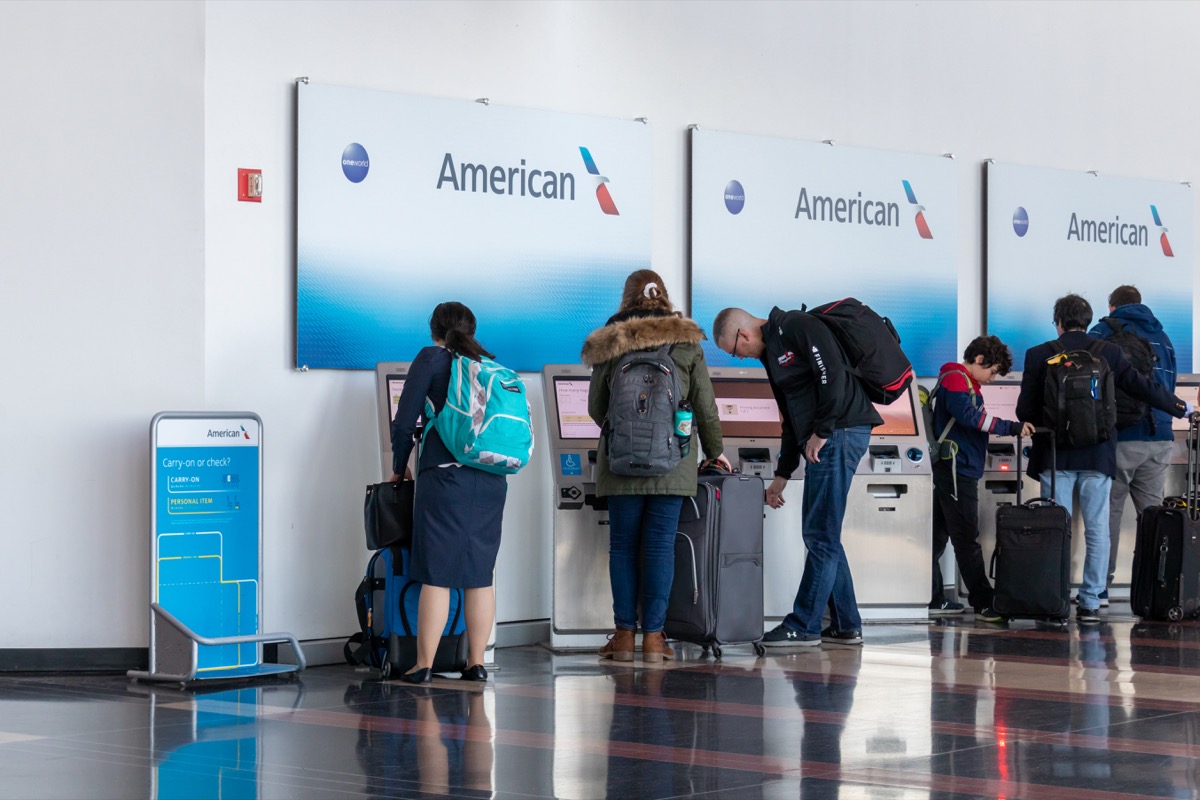 Inside Ronald Reagan Washington National Airport, passengers use the American Airlines self-serve check-in kiosks within terminal B/C. American Airlines is the fifth largest airline in the United States.