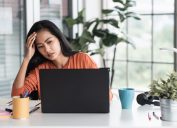 woman get stress about project in front of laptop while working from home.new normal with technology lifestyle