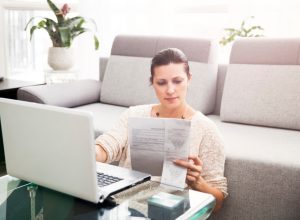 Woman in her 30s filling out tax information online