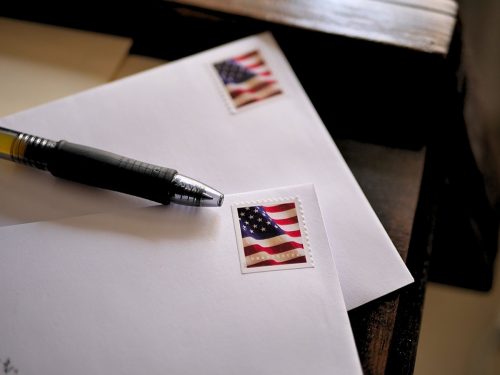 American Flag Stamps on Letters Ready to be Mailed