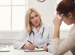 Woman Talking to a Female Doctor