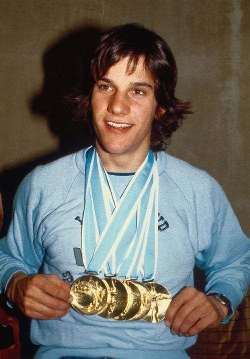 eric heiden showing off his five gold medals at the olympics