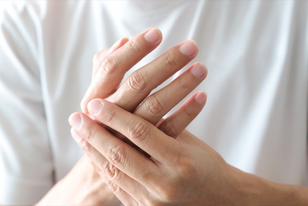 Closeup of woman's hands pain discomfort