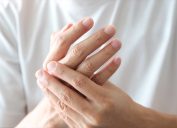 Closeup of woman's hands pain discomfort