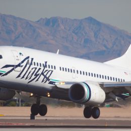 An Alaska Airlines plane landing at an airport