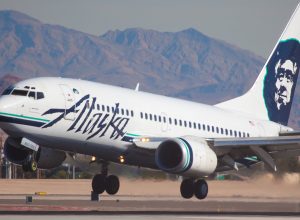 An Alaska Airlines plane landing at an airport
