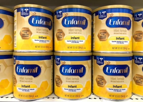 Grocery store shelf with canisters of Enfamil brand baby formula. Gentle Nutrition for infants 0-12 months. Produced by Mead Johnson, a subsidiary of Reckitt Benckiser