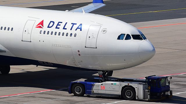 A Delta Air Lines plane taxiing on a runway