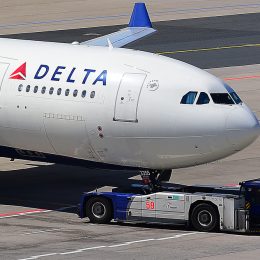A Delta Air Lines plane taxiing on a runway