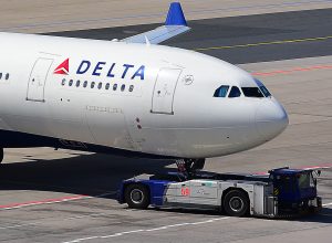 A Delta Air Lines plane taxiing on a runway