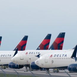 Delta Airplanes sit in a row at Kansas City International Airport