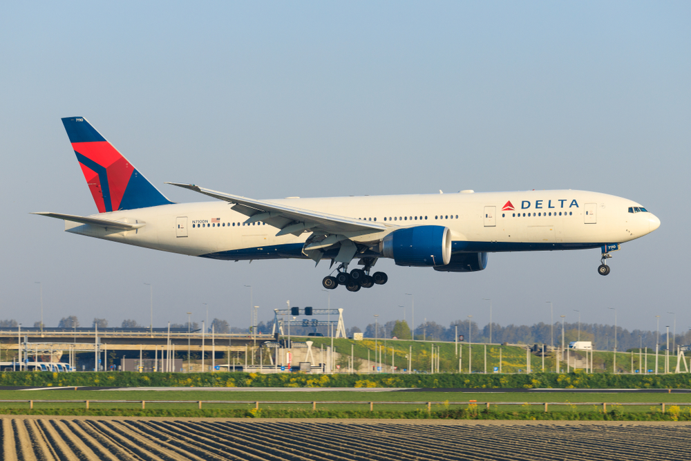 A Delta plane landing at an airport