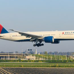 A Delta plane landing at an airport