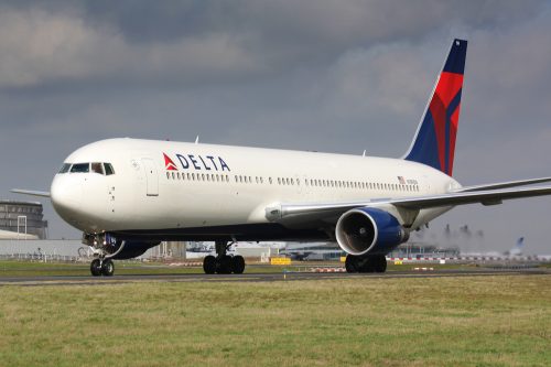 A Delta Air Lines plane sitting on a runway