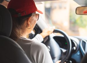 Rear view of woman driving a car