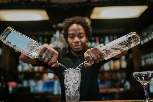 Bartender prepares a cocktail in a nightclub