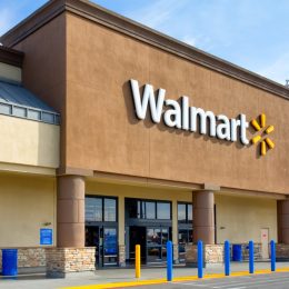Walmart store exterior. Walmart is an American multinational corporation that runs large discount stores and is the world's largest public corporation.