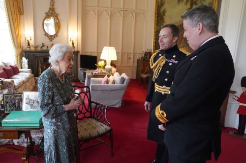 Queen Elizabeth meeting with outgoing Defence Service Secretary Rear Admiral James Macleod and incoming Defence Service Secretary Major General Eldon Millar on February 15, 2022 at Windsor Castle