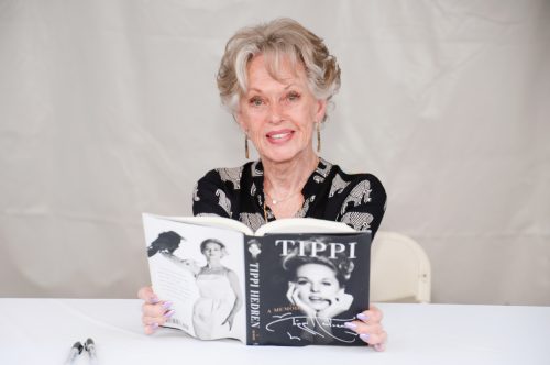 Tippi Hedren holding a copy of her memoir during the Los Angeles Times Festival Of Books in 2017