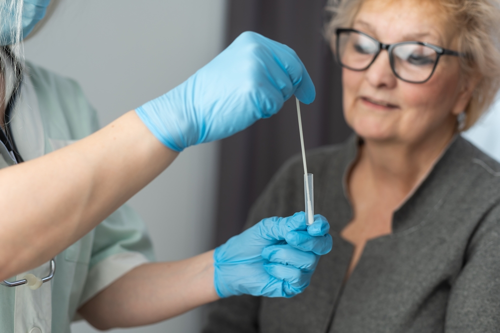 A woman about to receive a nasal swab for a COVID test