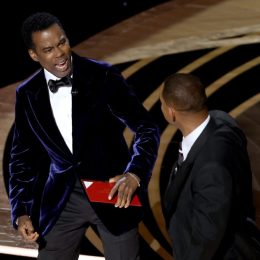chris rock reacts to being slapped by will smith onstage at the academy awards