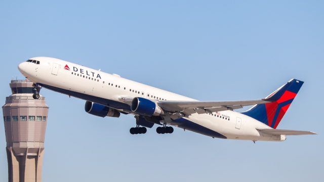 A Delta Air Lines plane taking off from an airport