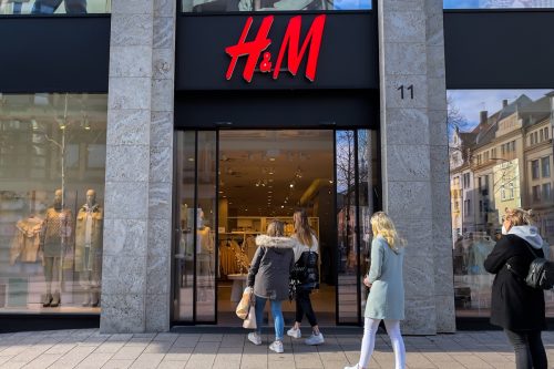 People walking into an H and M store in Fulda, Germany