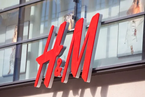 Logo of the Swedish retail-clothing company Hennes & Mauritz (H&M) on a store in the center of Munich (pedestrian area Kaufinger Street).