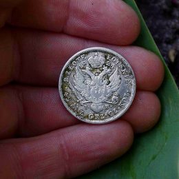 rare silver coin in hand