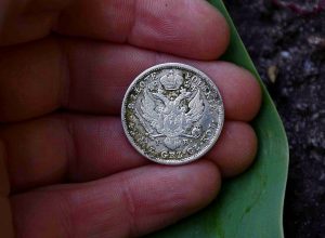 rare silver coin in hand