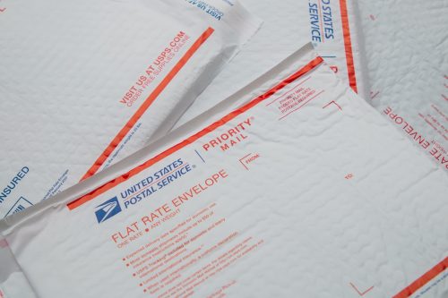 USPS Unites States Postal Service postmaster Priority Mail flat rate bubble envelope scattered display