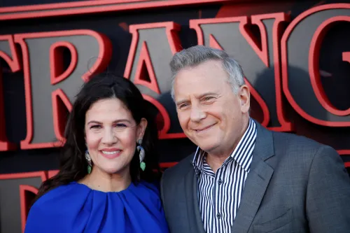 Paula Ravets and Paul Reiser at the "Stranger Things" season 3 premiere in 2019
