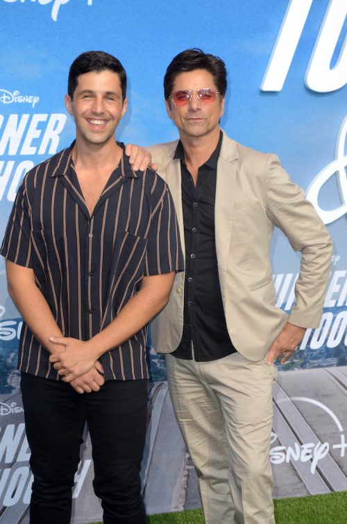 Josh Peck and John Stamos at the premiere of "Turner and Hooch" in 2021