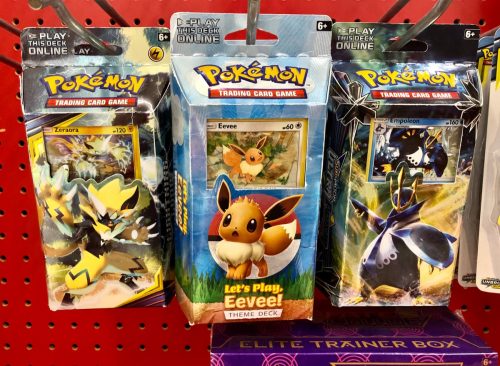Pokémon trading cards on a rack inside Target.