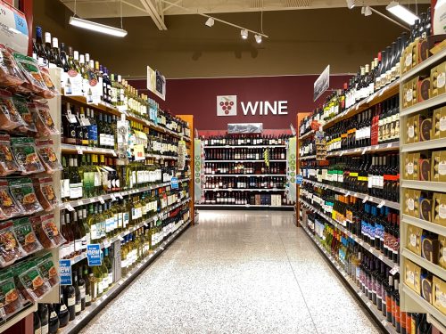 The wine aisle sign in a Publix grocery store with a variety of wines from different wineries.
