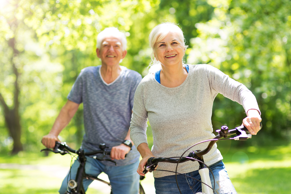 A senior couple riding bikes together