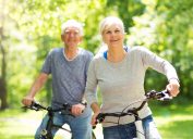 A senior couple riding bikes together