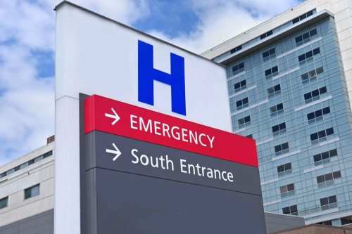 Direction sign for a hospital and emergency room